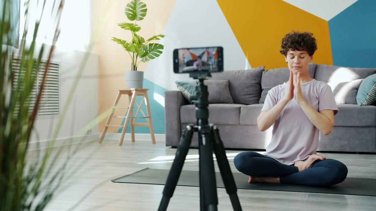 A person meditating with headphones on, representing mental clarity during weight loss.